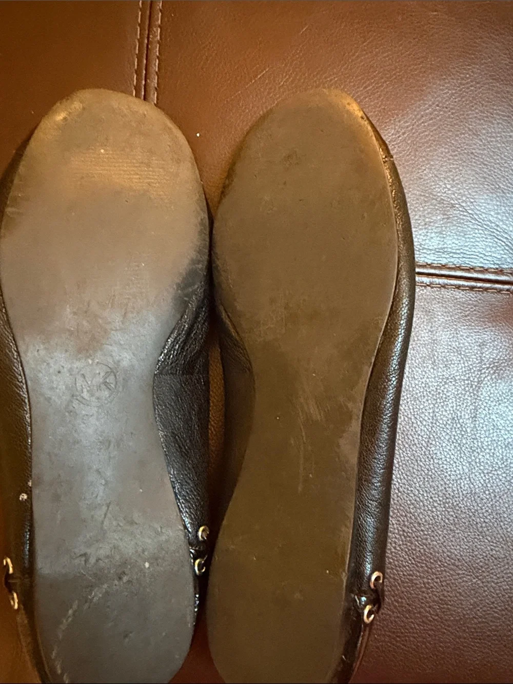 Micheal Kors black flats with grommet /leather detail sz 9.5